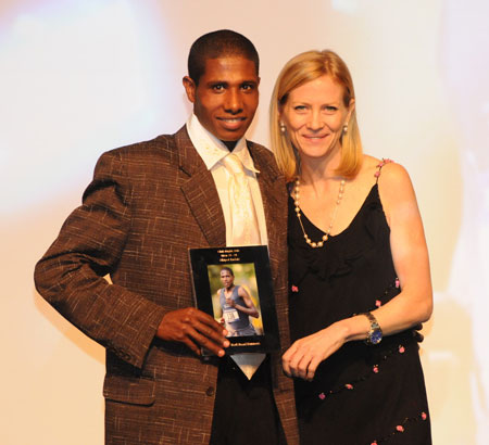 Men's age 20-24 Runner of the Year award, Abiyot Endale with NYRR CEO Mary Wittenberg (Photo Courtesy of NYRR)
